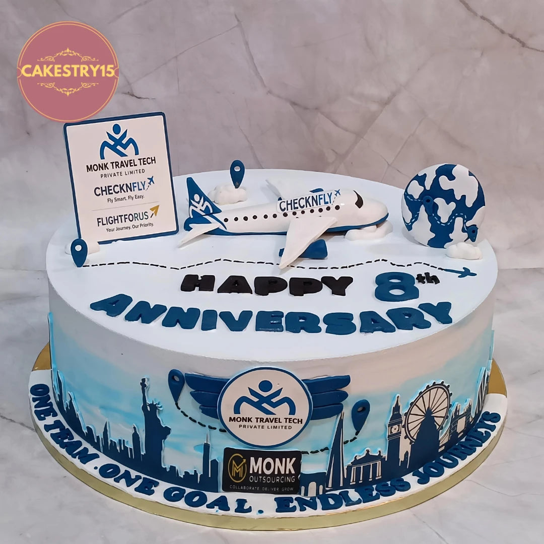 Premium eggless corporate anniversary cake with airplane, globe and company branding, handcrafted as a designer cake in Noida for business celebrations.