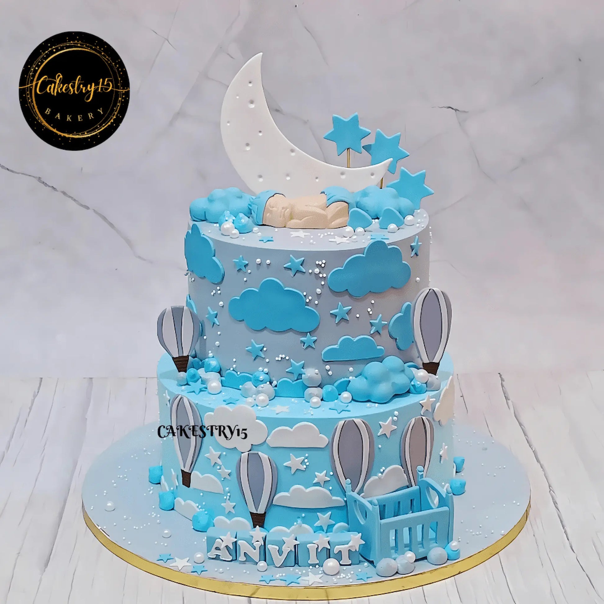 Moonlit Baby Bliss eggless baby shower cake with baby cot, moon, clouds and stars by Cakestry15 Noida