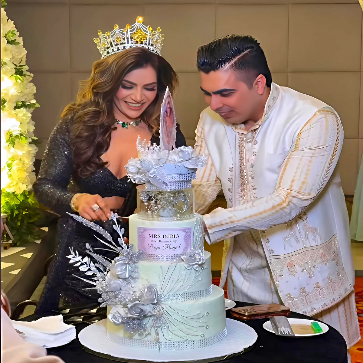 Mrs India winner cutting her 3 tier custom cake during the celebration.