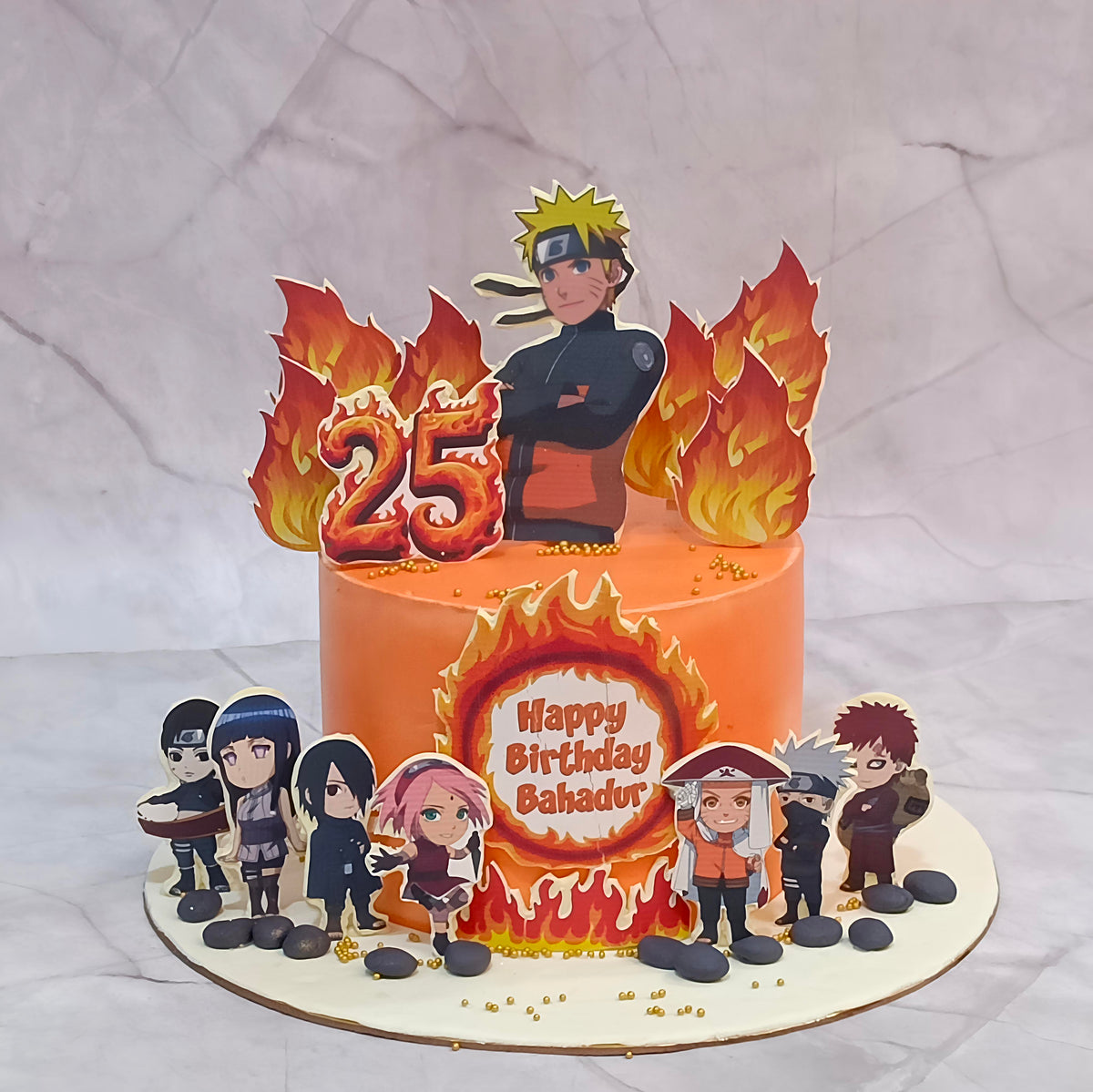 Naruto theme birthday cake with edible images of Naruto and its characters, flames all over and an age tag.
