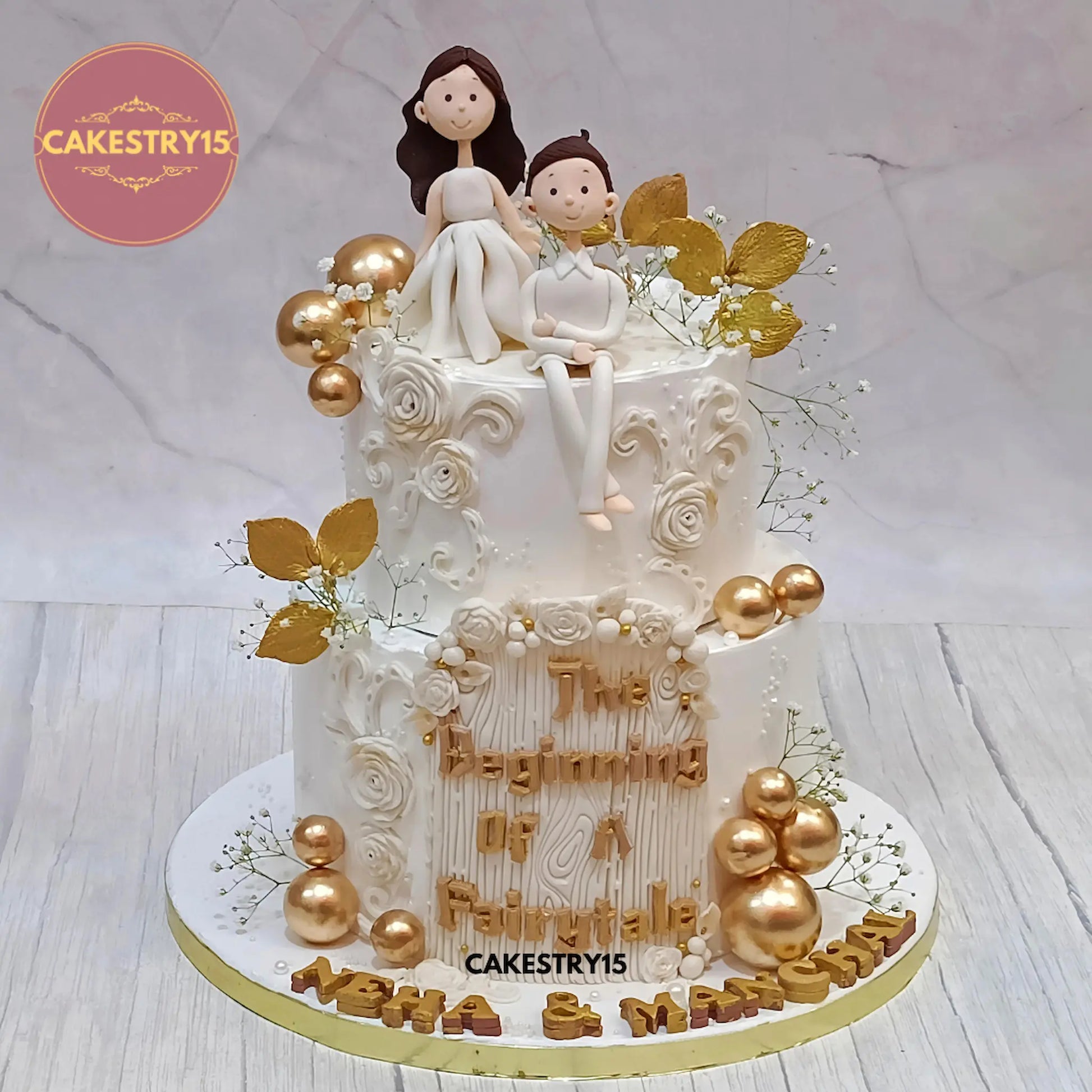 3kg black forest engagement cake with white figurines, roses, golden leaves from Cakestry15 in noida