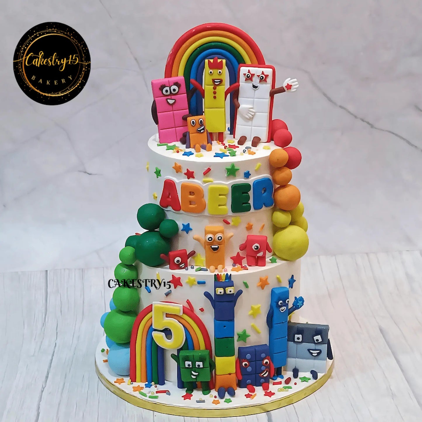 Number Blocks kids birthday cake with rainbow design and colourful decor, perfect as a theme cake Noida families order for premium eggless cakes.