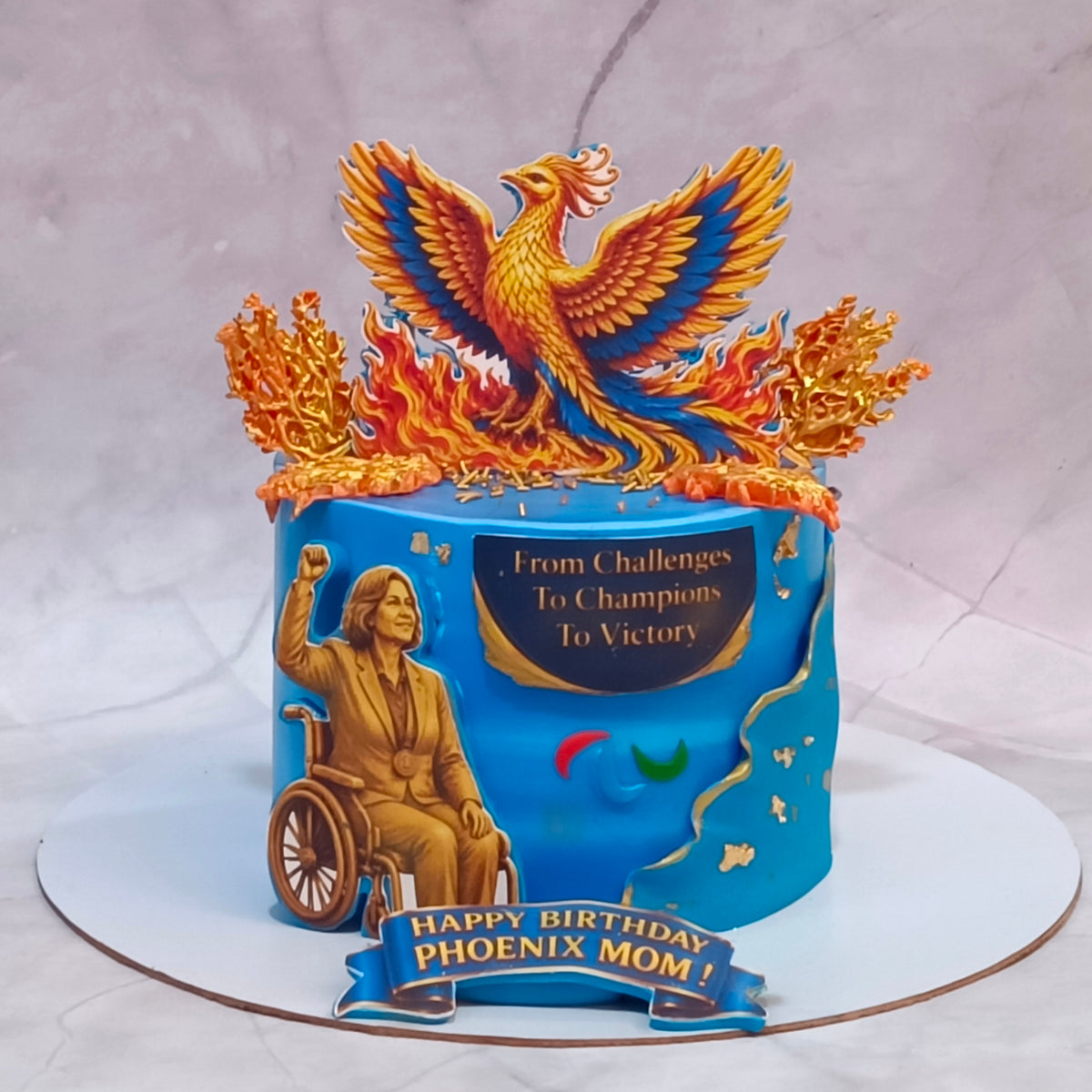 Paralympics winner womens birthday cake with edible images and marble fondant, featuring a theme cake Noida from our eggless cakes range.