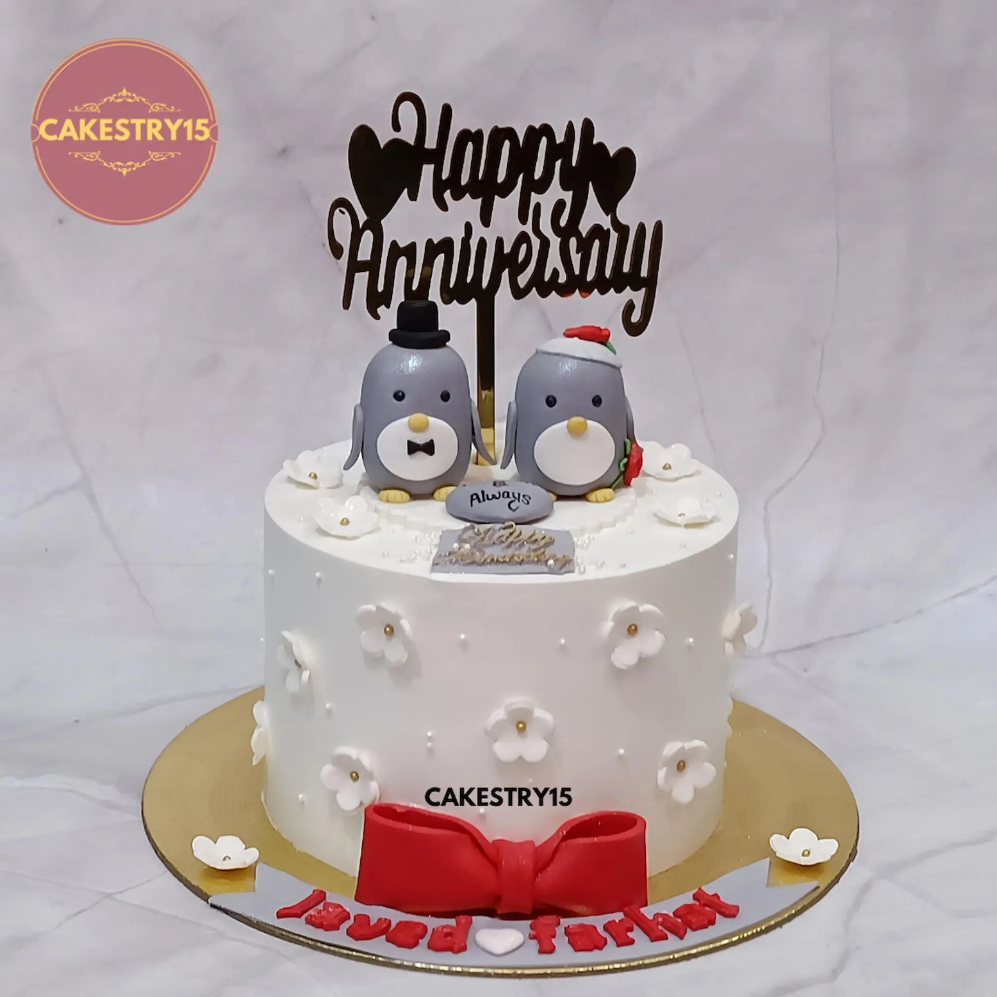 1kg pineapple eggless anniversary cake with penguin toppers from Cakestry15 in Noida