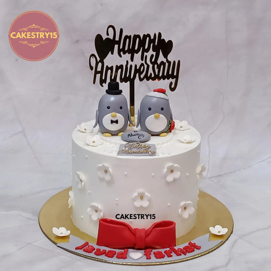1kg pineapple eggless anniversary cake with penguin toppers from Cakestry15 in Noida