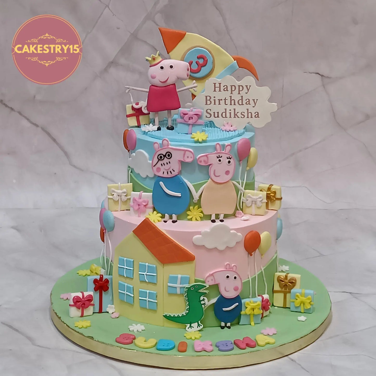 Peppa Pig theme 3rd birthday cake in chocolate flavour with edible characters, rocket, balloons and clouds design in Noida