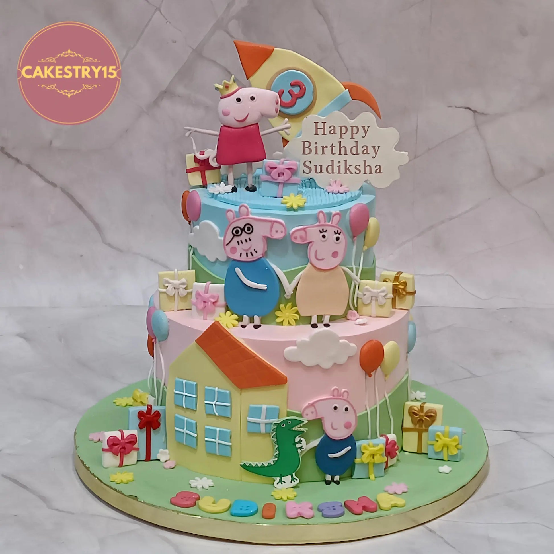 Peppa Pig theme 3rd birthday cake in chocolate flavour with edible characters, rocket, balloons and clouds design in Noida
