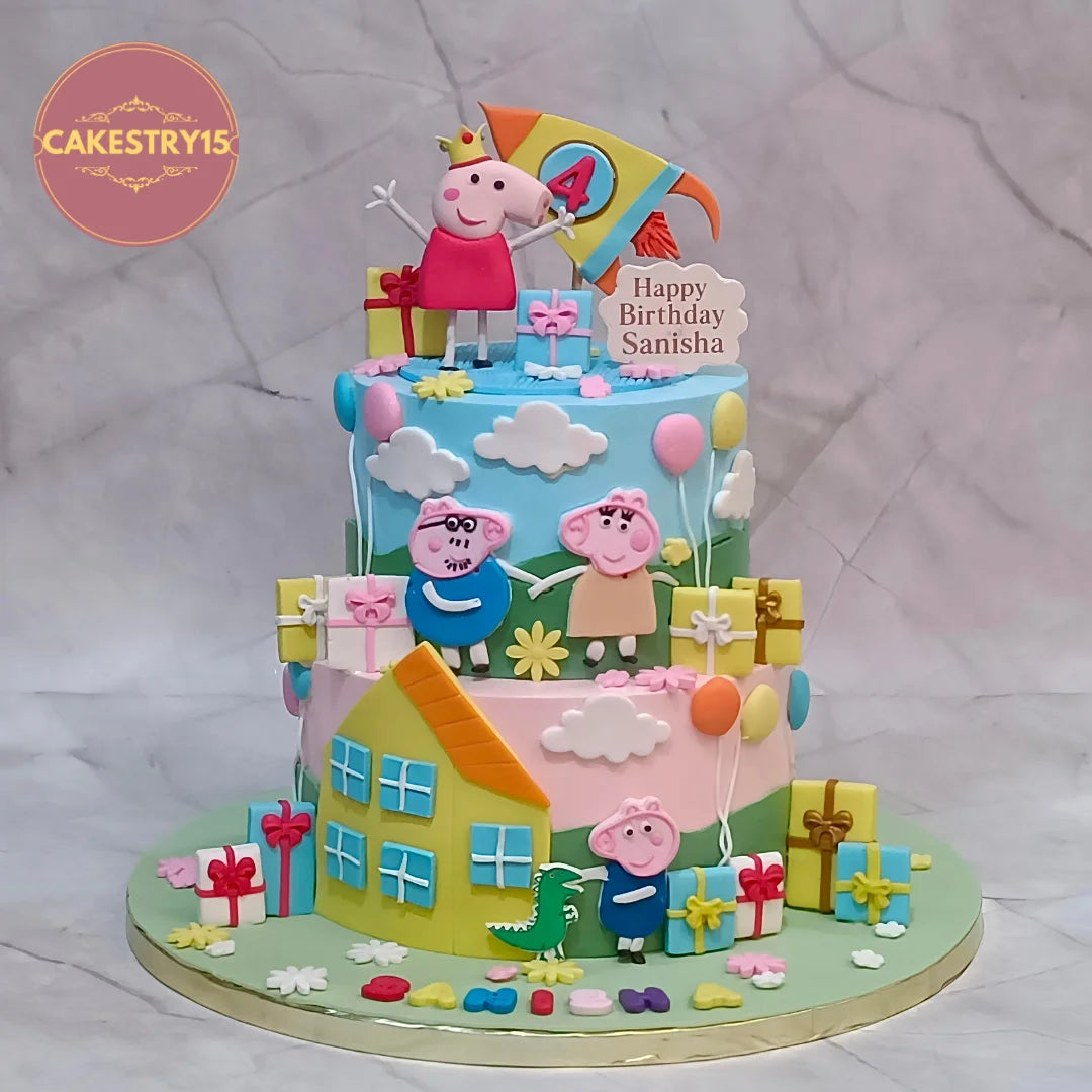 A 2-tier custom birthday cake decorated with Peppa Pig characters, a house, balloons, and gift boxes, displayed on a marble background with a Cakestry15 logo in the top left corner.