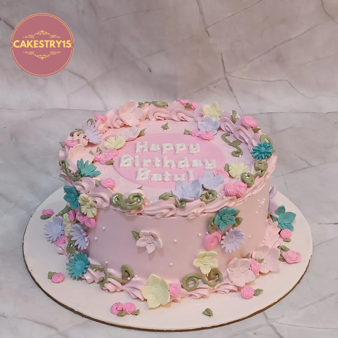 Pink Floral Delight is a premium eggless cakes design featuring colourful blooms, crafted as a beautiful theme cake Noida families choose for a girls birthday cake celebration.