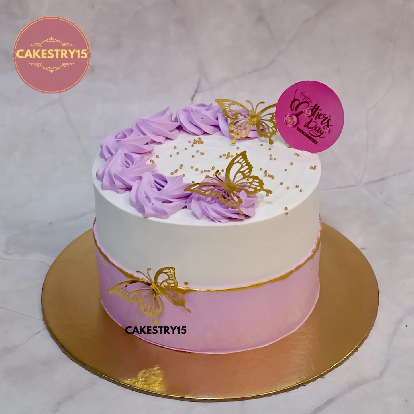 1kg eggless pineapple birthday cake with pink rosettes and golden butterflies from Cakestry15