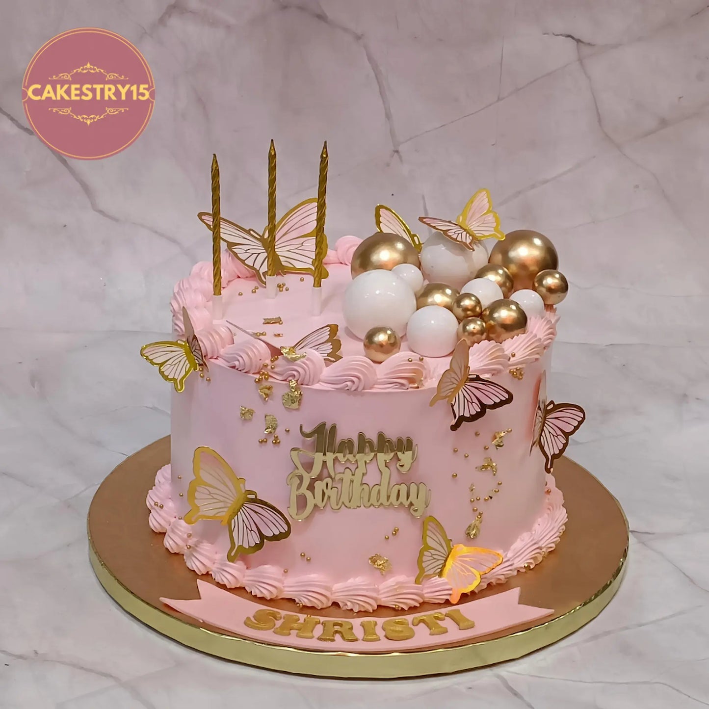 Elegant pink theme eggless birthday cake for wife with chocolate flavour and premium golden decorations in Noida by cakestry15
