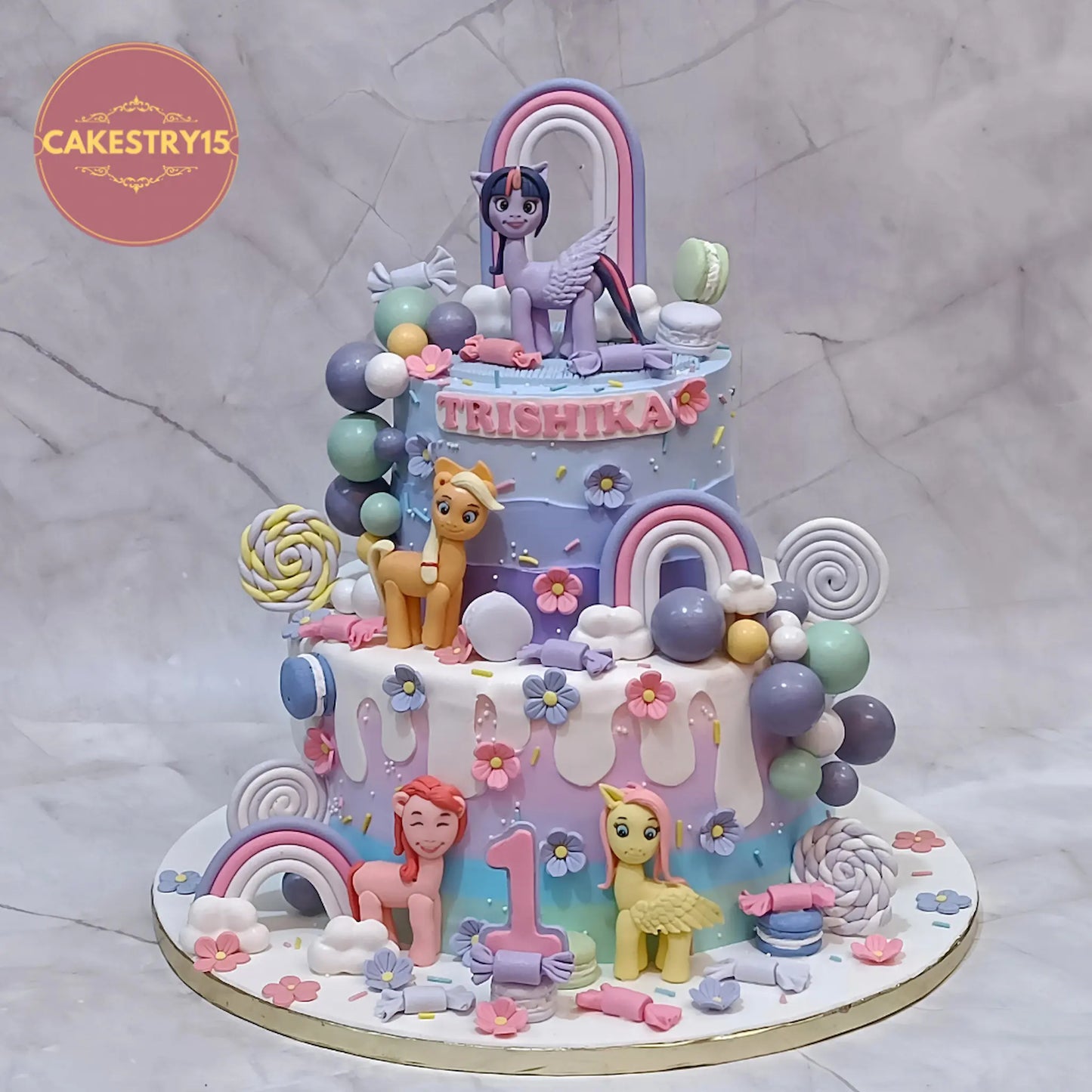 Pony theme 6kg eggless chocolate first birthday cake for girl with rainbows, ponies, clouds, candies and faux balls by Cakestry15 Noida