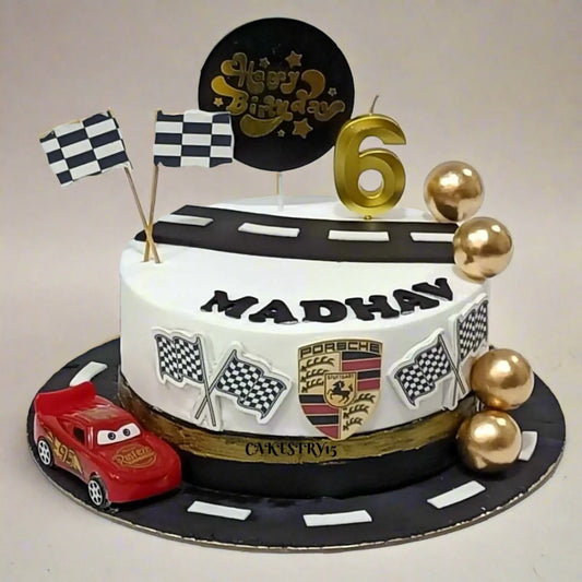 Porsche theme eggless chocolate kids birthday cake with racetrack and car design by Cakestry15 in Noida