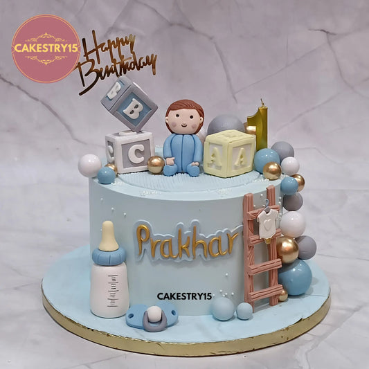 2kg black forest baby boy 1st birthday cake from Cakestry15 featuring figurine, ABC blocks, and pacifier