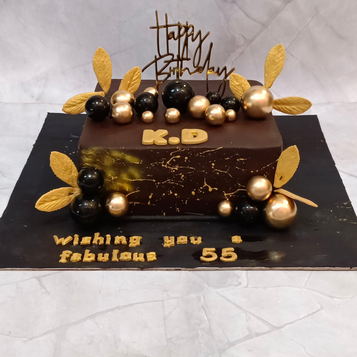 Premium Black and Gold Birthday Cake handcrafted as a kids birthday cake style theme cake Noida with fresh eggless cakes for elegant birthday celebrations.