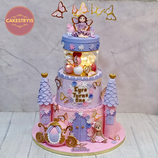Princess doll kids birthday cake with castle and rotating topper, premium theme cake Noida families love, handcrafted eggless cakes for first birthday celebrations.
