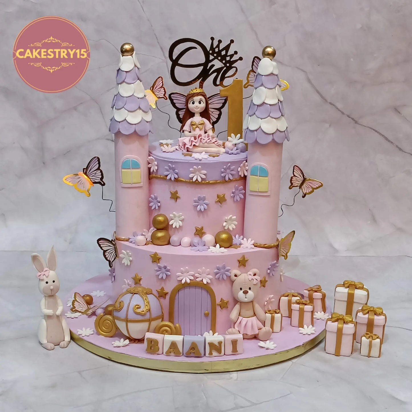 Princess fairy castle theme first birthday cake for girls with fondant figurine, butterflies and castle design in Noida