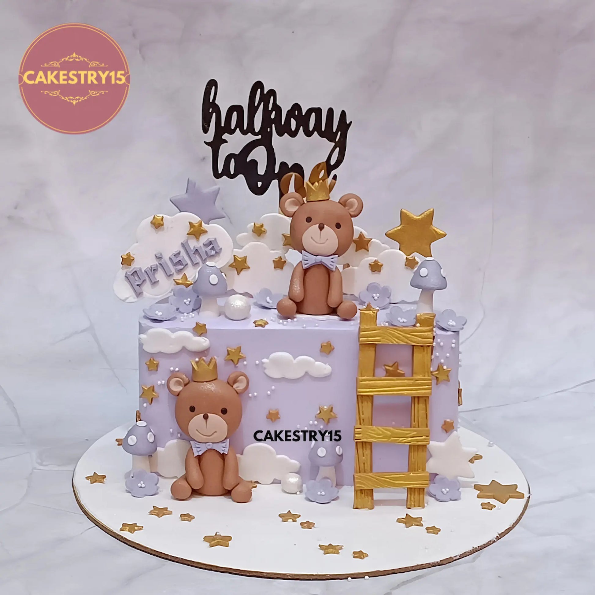 1kg butterscotch halfway to one theme cake with teddy bears, clouds, stars, ladder, and mushrooms from Cakestry15 Noida
