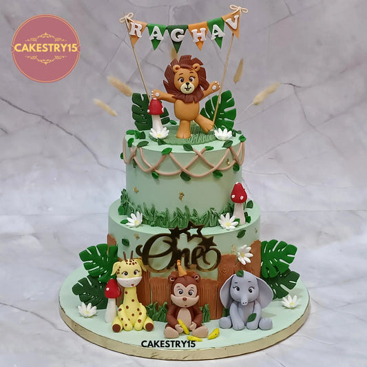 3kg chocolate jungle theme first birthday cake with lion topper, giraffe, monkey, elephant by Cakestry15 Noida
