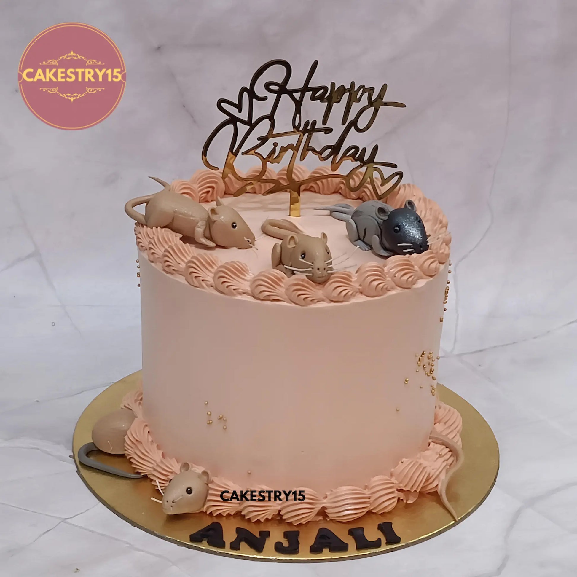 Eggless rat theme kids birthday cake in Noida with fondant rat figurines and pineapple flavour for fun celebrations.