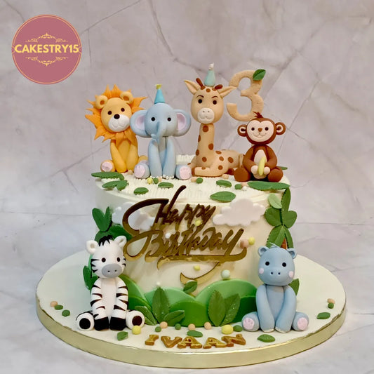Roaring jungle kids birthday cake in Noida with safari animal figurines, premium jungle detailing, and eggless chocolate flavour.