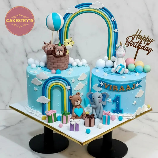 A safari unicorn kids birthday cake with a rainbow design from an eggless cakes bakery offering a theme cake Noida.