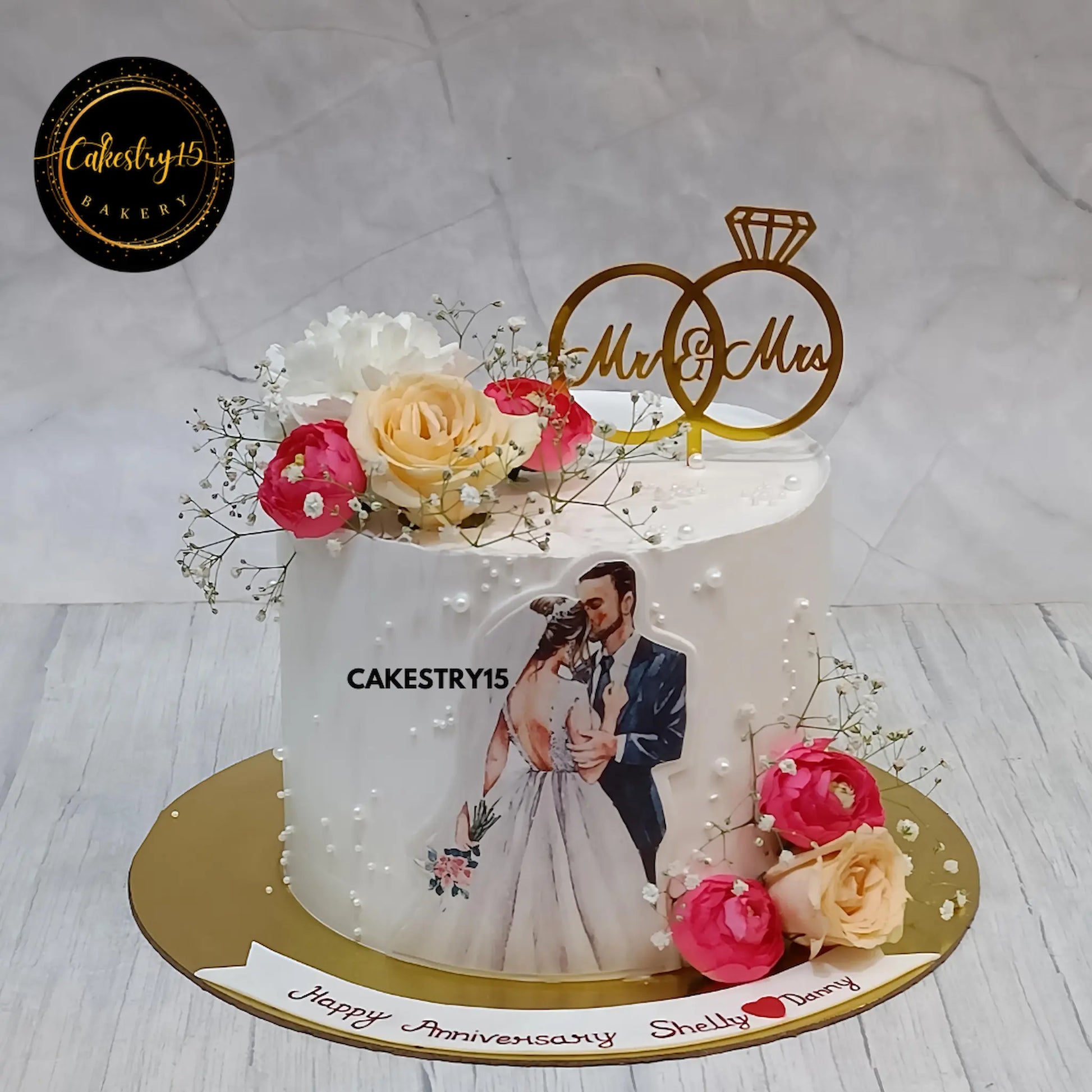 Eggless blueberry anniversary cake with couple photo and floral decor from Cakestry15

