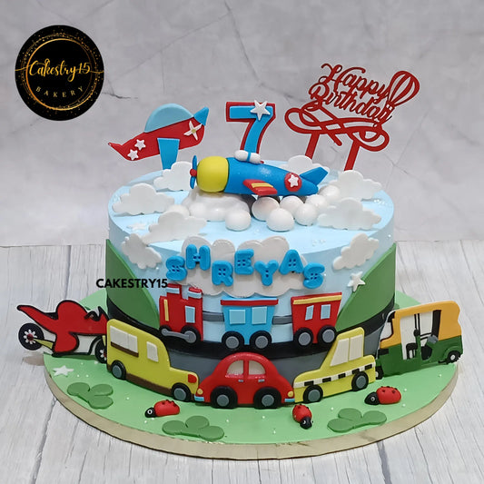 2kg pineapple cake with gliders, train, and bike design for 7th birthday from Cakestry15