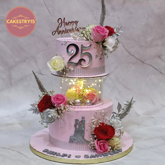 Elegant silver jubilee 25th anniversary eggless cake with floral spacer design, roses, and custom names by Cakestry15 Noida