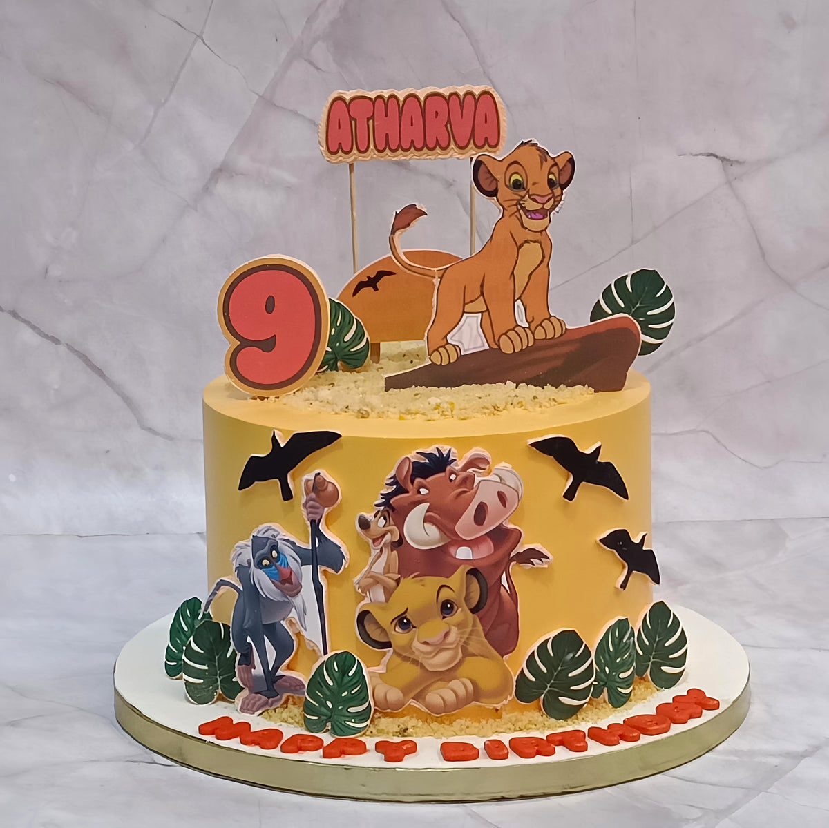 Premium Simba kids birthday cake featuring edible Simba images, jungle animals and green leaves, handcrafted as a theme cake Noida using fresh eggless cakes.
