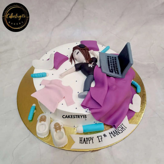 1kg chocolate birthday cake featuring a sleeping girl figurine, laptop, clothes, shoes, and a sipper bottle by cakestry15 noida, best bakery noida
