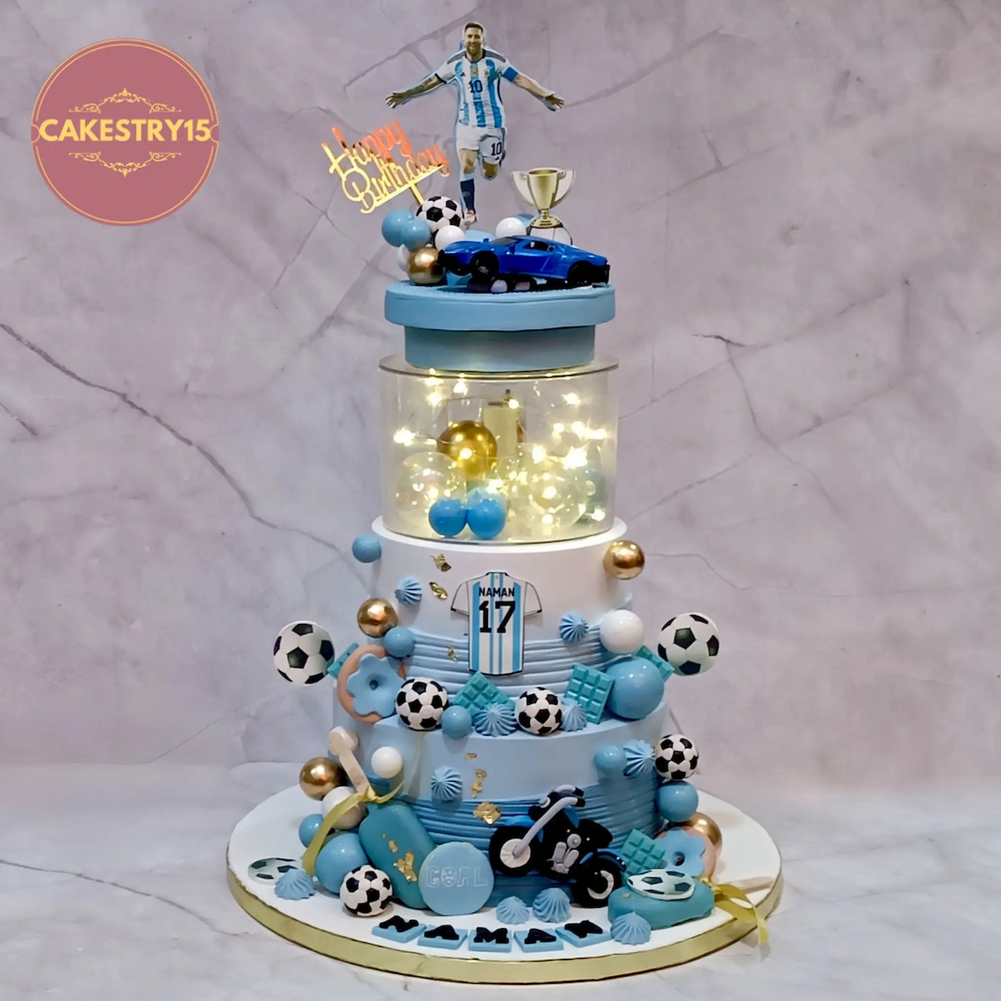 Soccer theme 17th birthday cake with Messi topper, footballs, Ferrari car and fondant bike, 3kg eggless custom cake for kids in Noida