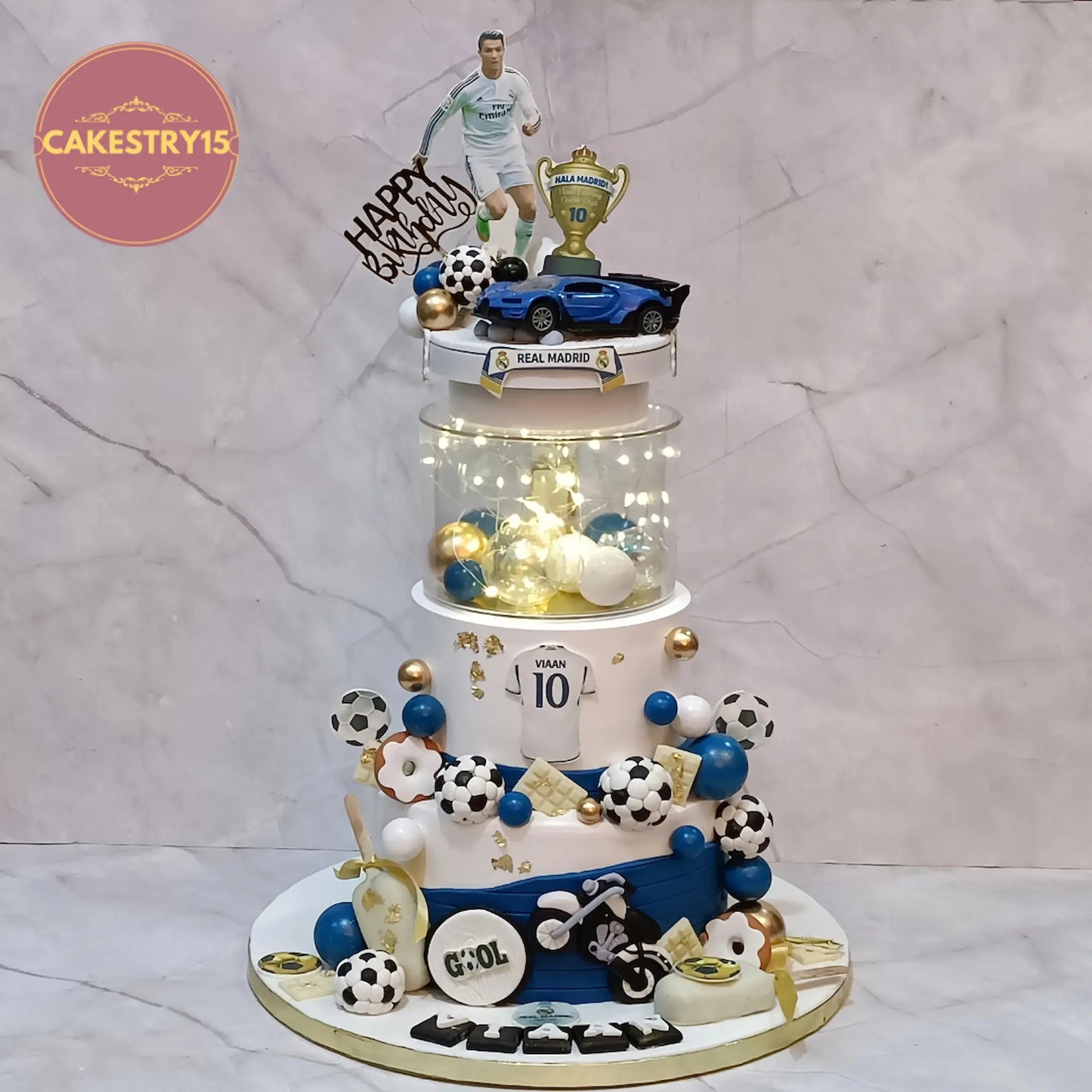 Soccer theme 10th birthday cake with Ronaldo topper, footballs, Ferrari car and fondant bike, 3kg eggless kids birthday cake in Noida