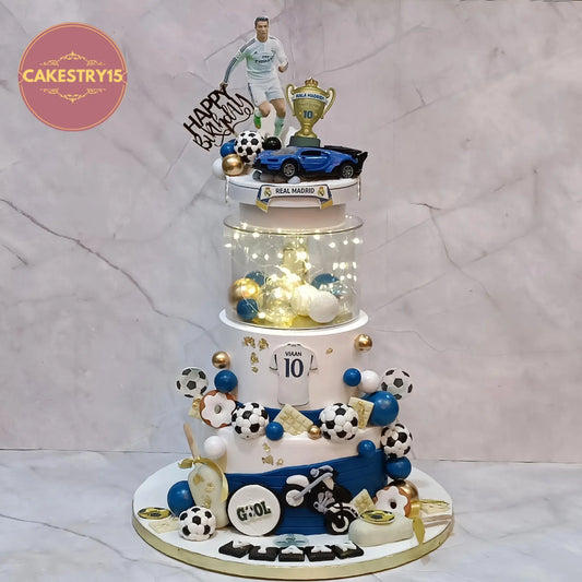Soccer theme 10th birthday cake with Ronaldo topper, footballs, Ferrari car and fondant bike, 3kg eggless kids birthday cake in Noida