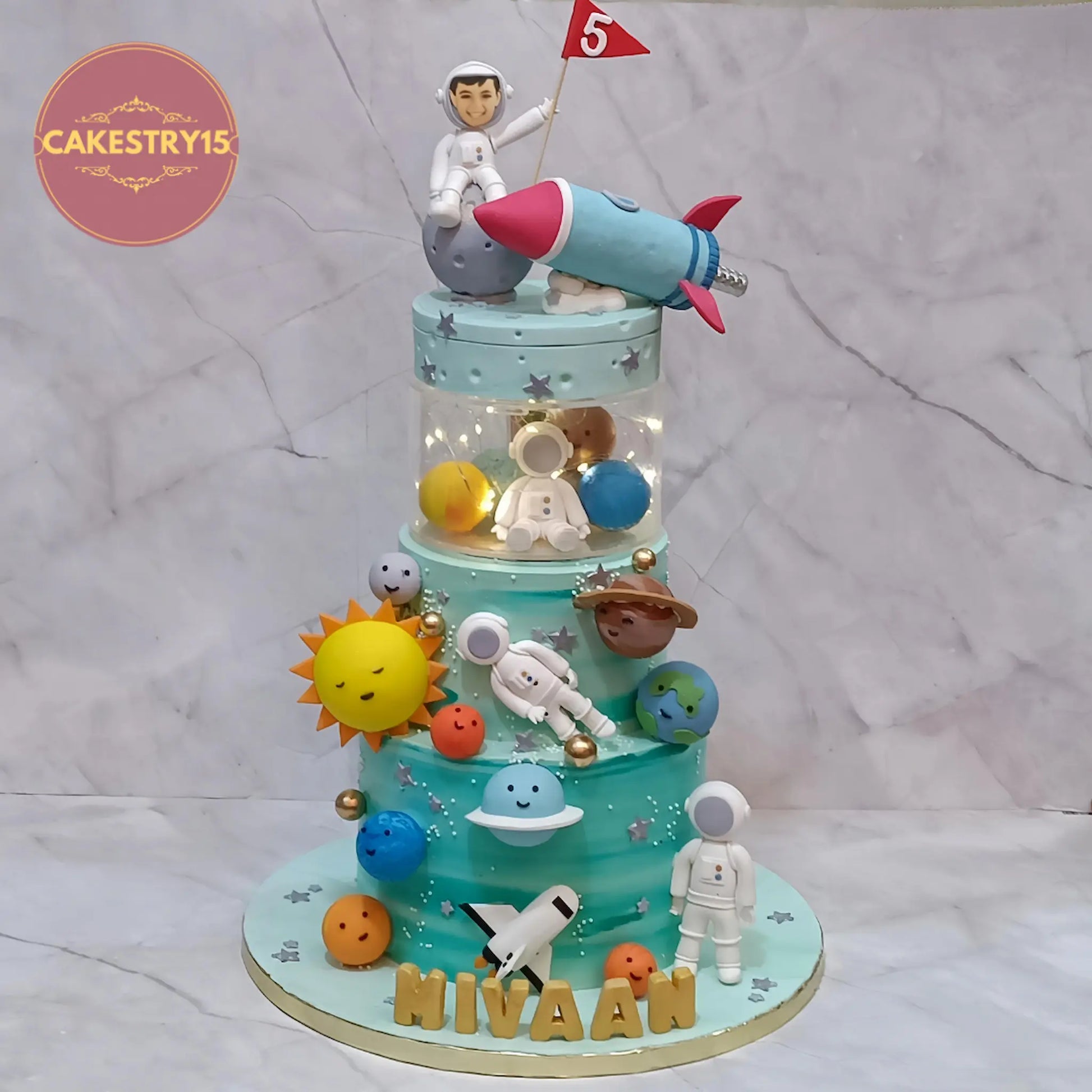 Space theme 5th birthday cake for kids in chocolate flavour with astronauts, planets, rocket and rotator design, eggless cake Noida