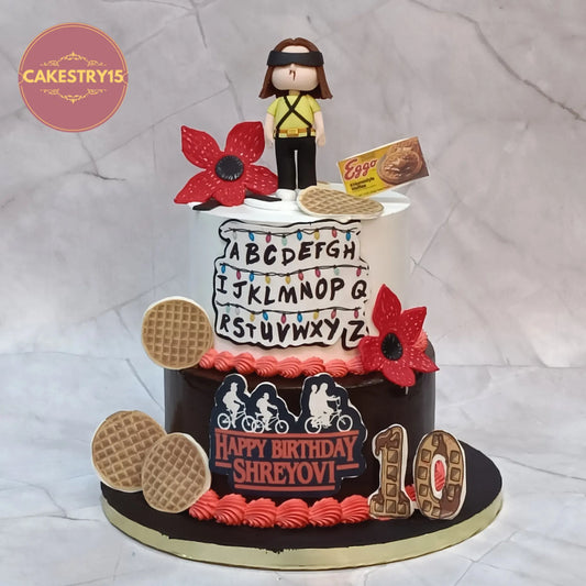 Stranger Things theme 10th birthday cake with alphabet wall lights, Eleven, Demogorgon and chocolate finish in Noida