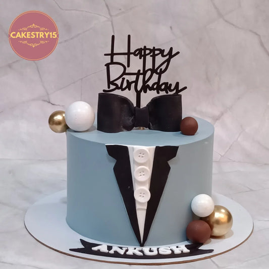 Suit theme kids birthday cake with fondant details from an eggless cakes bakery offering a theme cake Noida.