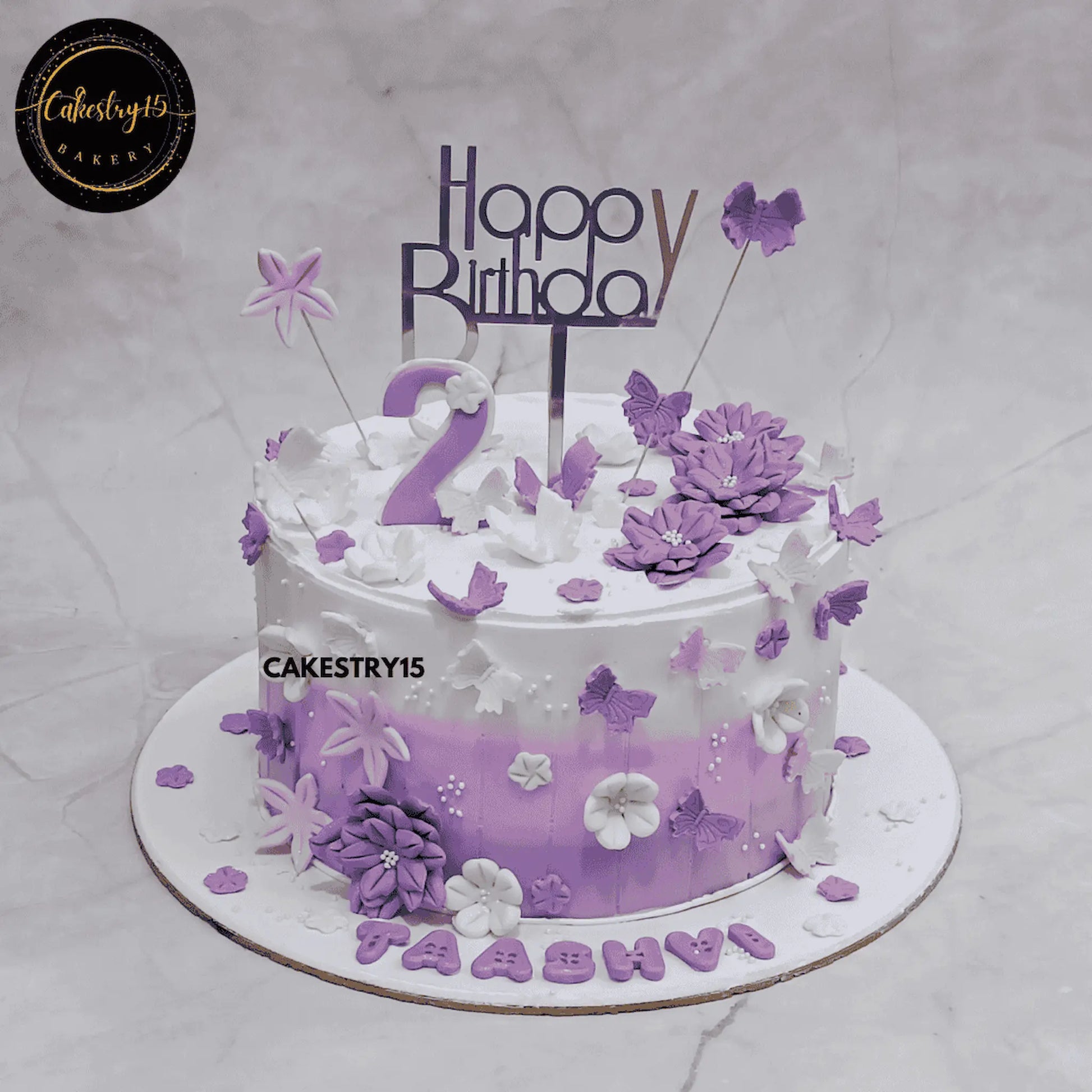 2-tier lavender and ivory butterfly birthday cake for 2-year-old girl named Taashvi by cakestry15,best bakery noida