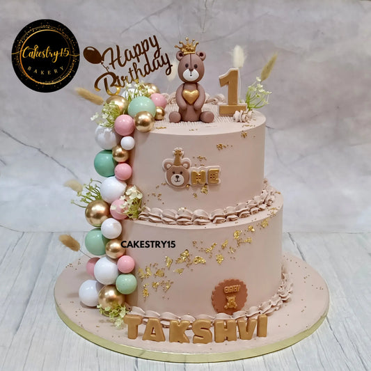 Teddy theme 5kg choco vanilla first birthday cake with crown topper made by Cakestry15 in Noida
