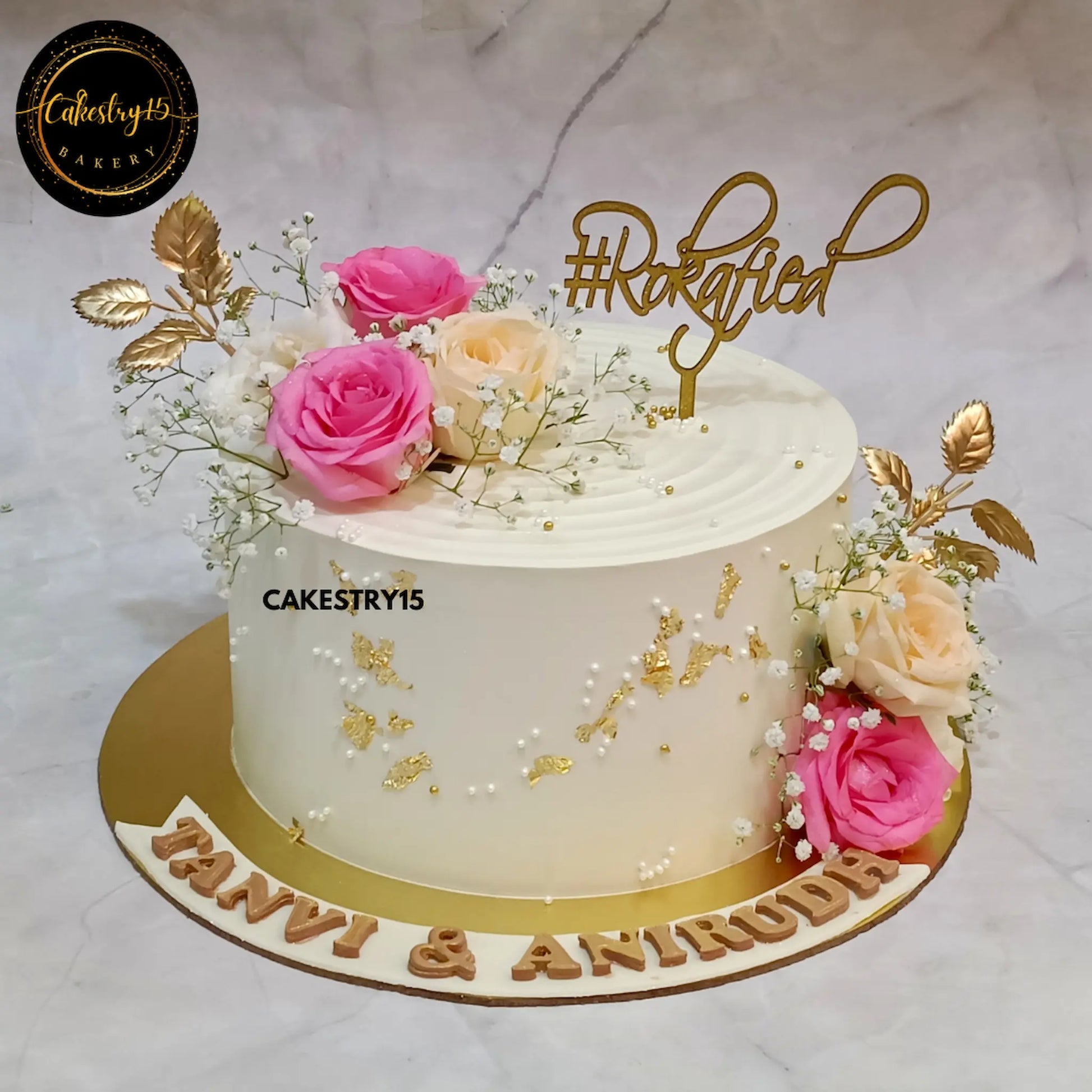 2kg blueberry eggless engagement cake with roses and rokafied topper from Cakestry15