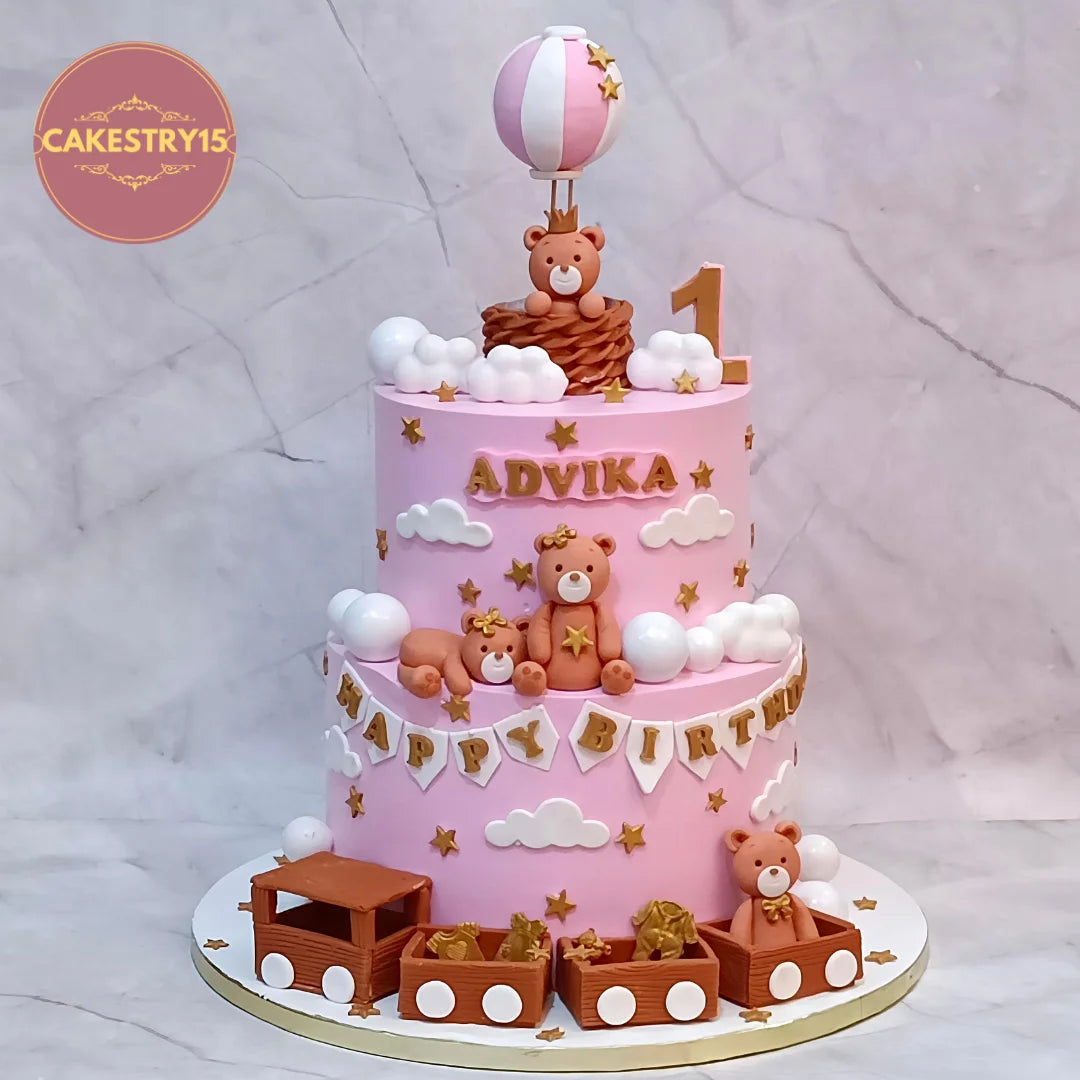 Teddy bear train kids birthday cake with an air balloon, clouds and stars from an eggless cakes bakery offering a theme cake Noida.