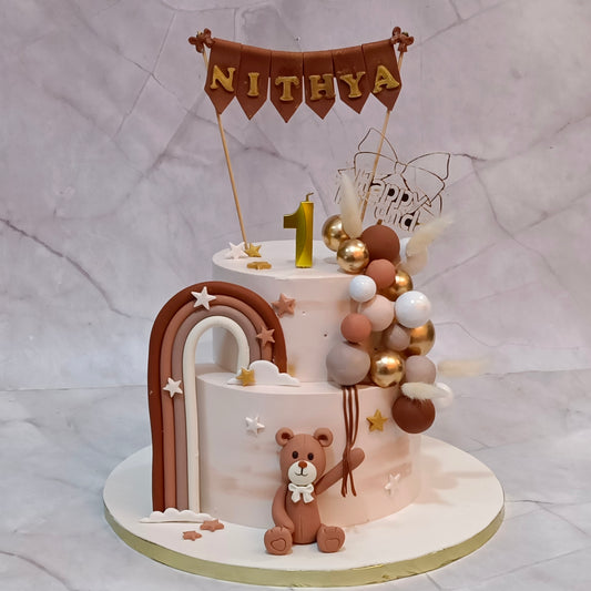 Teddy Dreams kids birthday cake with fondant teddy, rainbow and balloon design, handcrafted as a premium theme cake Noida using fresh eggless cakes.