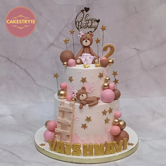 Teddy theme 2 tier kids birthday cake with black forest flavour, featuring teddy toppers, stars and balls, custom eggless cake in Noida