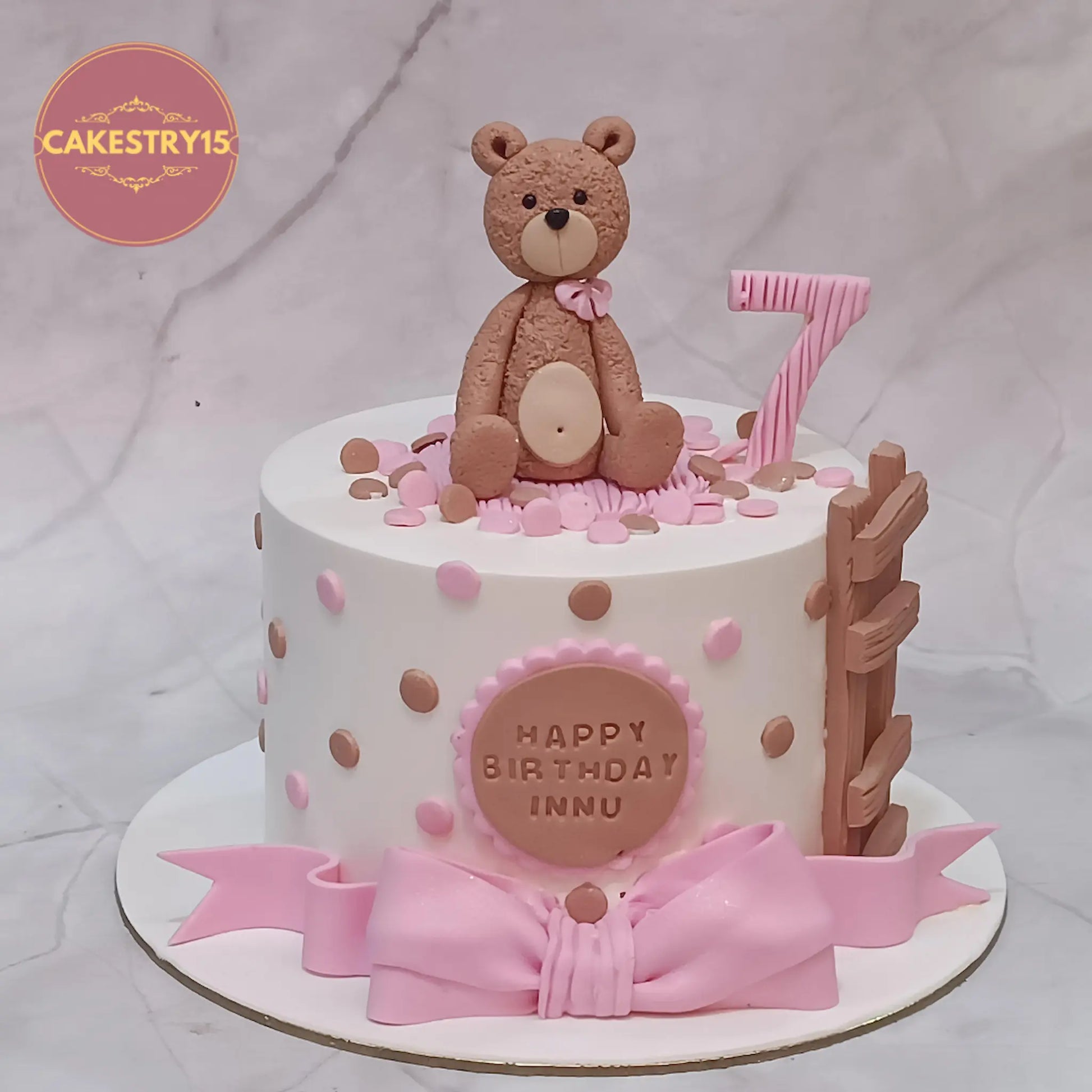 Eggless teddy theme 7th birthday cake for Innu in pineapple flavour, custom kids birthday cake by Cakestry15 Noida