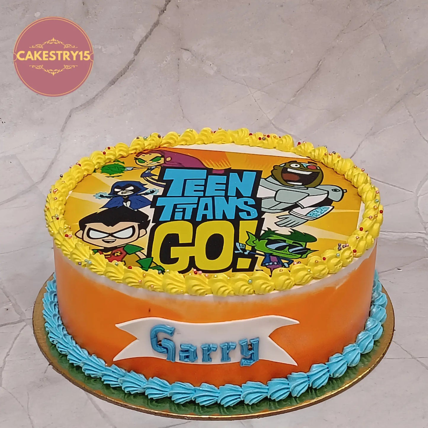 Teen Titans Go kids birthday cake with orange icing, premium theme cake Noida and eggless cakes for boys birthday celebrations.