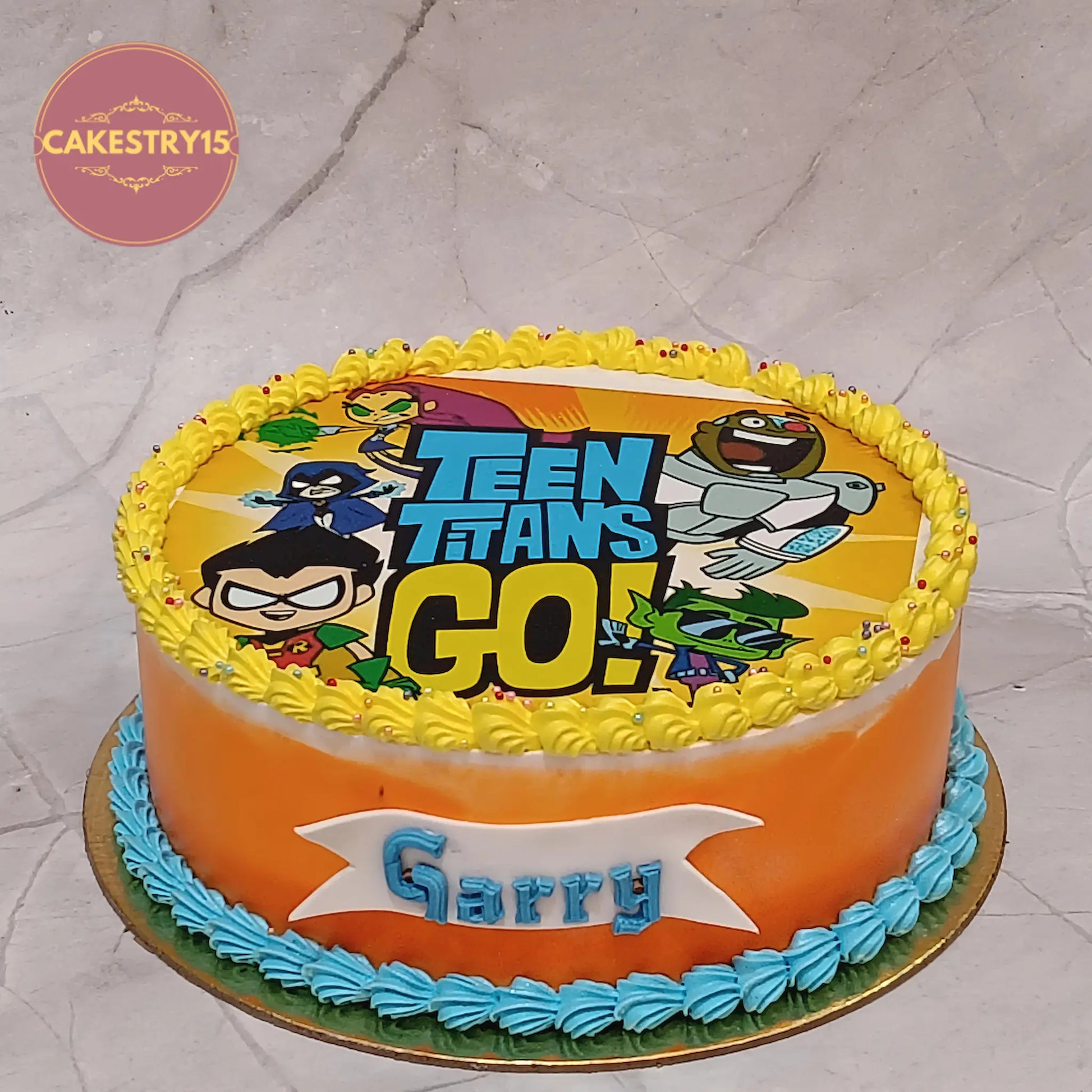 Teen Titans Go kids birthday cake with orange icing, premium theme cake Noida and eggless cakes for boys birthday celebrations.