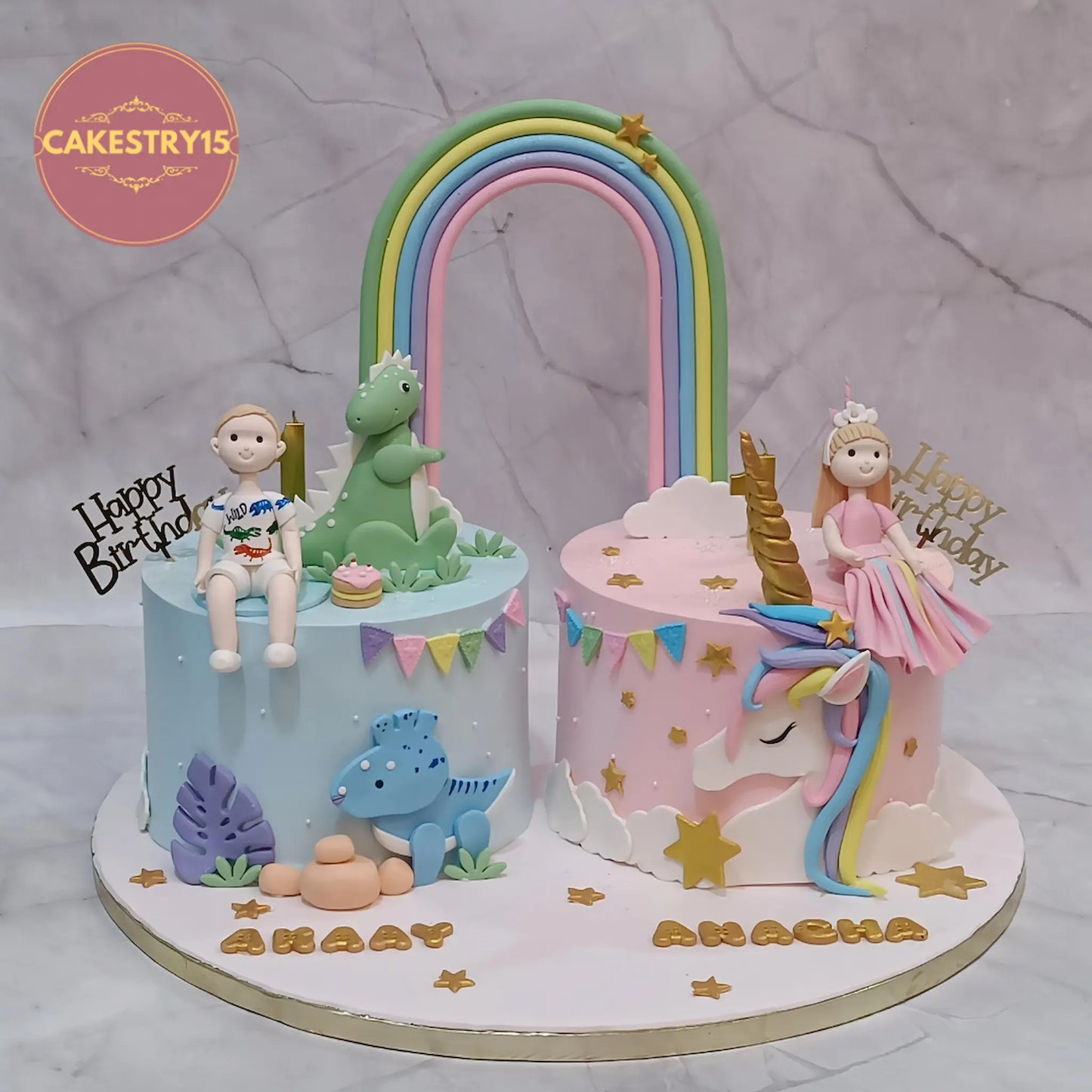 Eggless twins first birthday cake with rainbow, dinosaur and unicorn theme for boy and girl kids birthday celebration in Noida by cakestry15