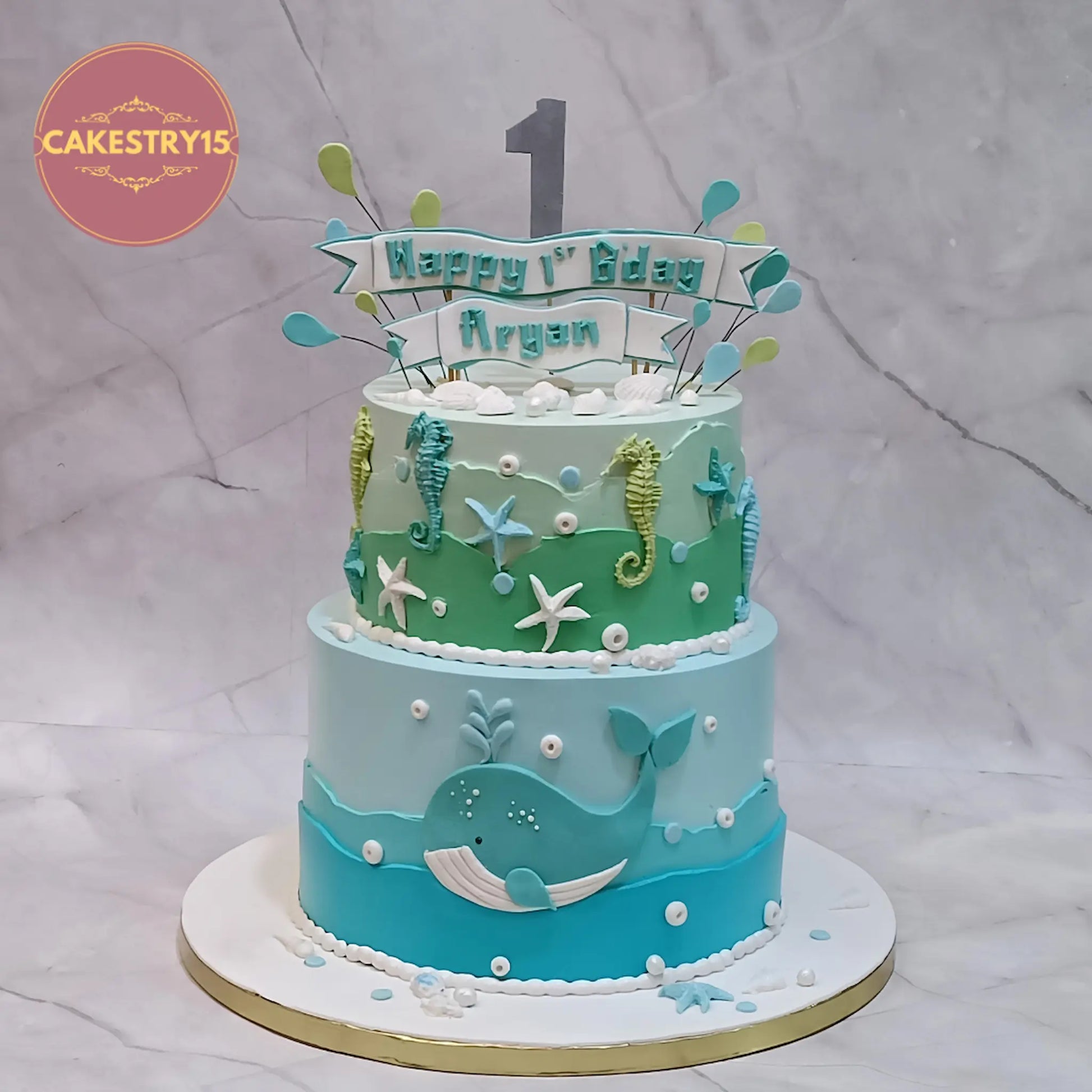 Under sea theme first birthday cake with whale, seahorse and starfish in aquatic colours, eggless custom kids birthday cake in Noida