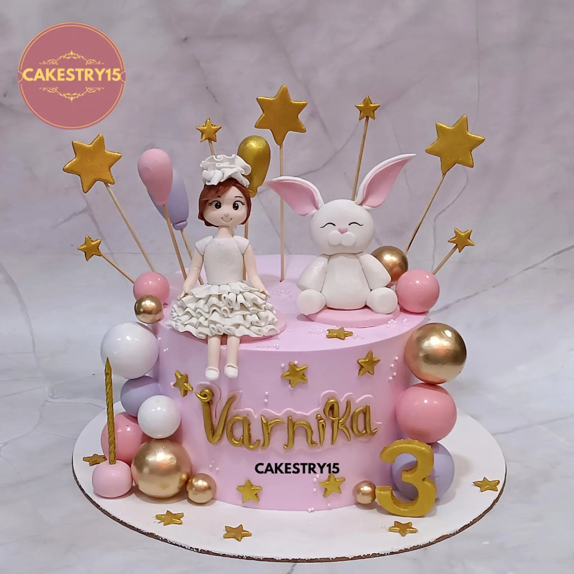 2kg chocolate cake for Varnika’s 3rd birthday with girl and rabbit figurines, balloons, stars, and multi-color balls from Cakestry15