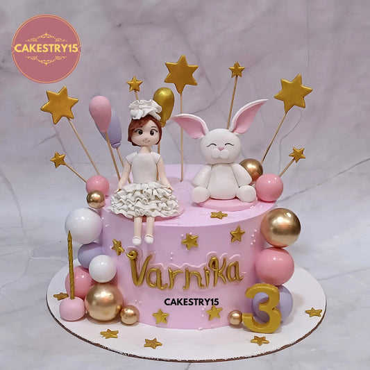 2kg chocolate cake for Varnika’s 3rd birthday with girl and rabbit figurines, balloons, stars, and multi-color balls from Cakestry15